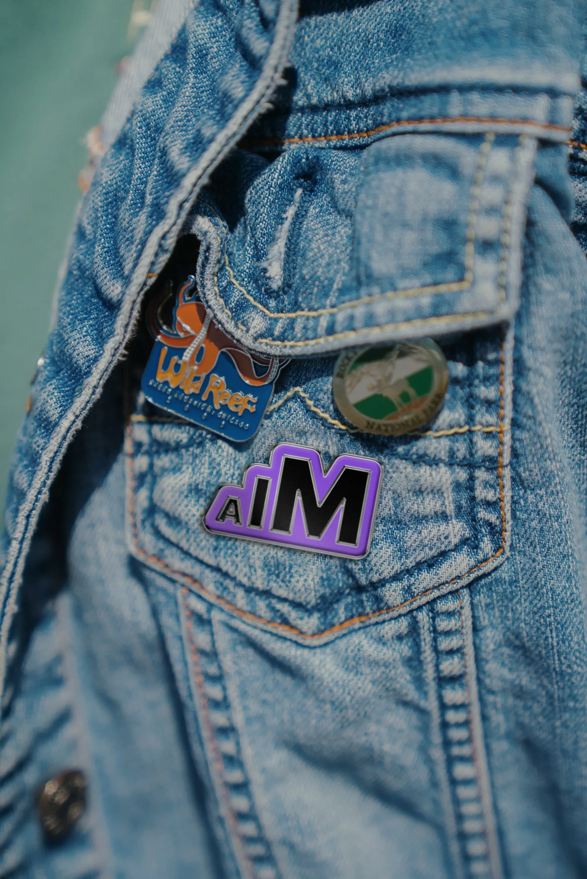 AIM Enamel Pin Mock Person Purple Working